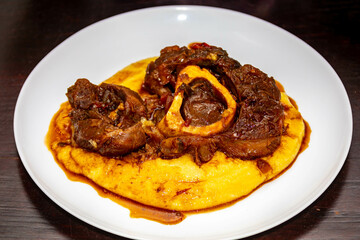 Traditional rustic recipe for ossobuco with polenta