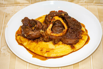 Traditional rustic recipe for ossobuco with polenta