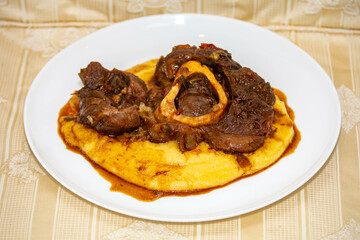 Traditional rustic recipe for ossobuco with polenta