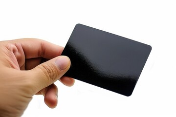 Black card held by a hand on white background. Symbol of elegance, invitation, or business.
