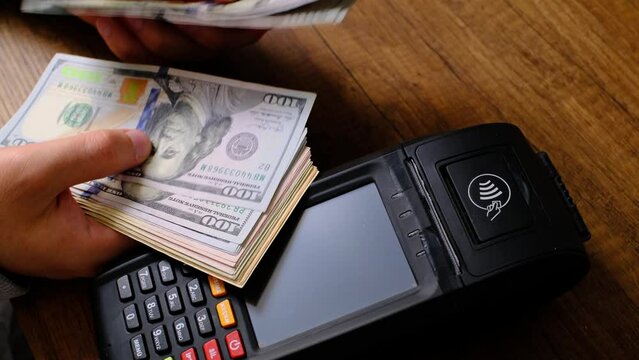 pos machine clamp and money close up