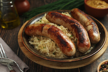 A bowl with Bratwurst and Sauerkraut as side dish - traditional German food	
