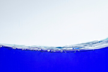 Blue water waves and air bubbles