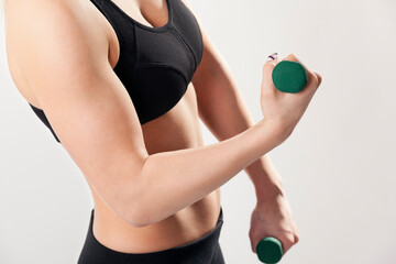 Fototapeta premium Close up of a woman lifting weights