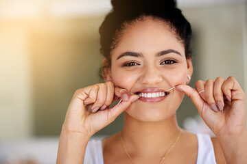 Smile, dental floss and portrait of woman with cleaning teeth for morning mouth routine in bathroom. Happy, dentistry and face of female person with oral care thread for hygiene treatment at home.