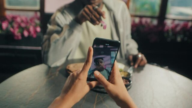 Black man eating and talking about his food