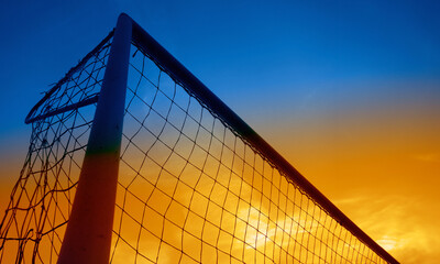 soccer goal silhouette at sunset 