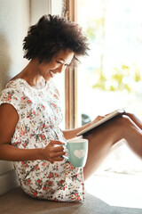 Woman, reading and book in home with coffee, door way and sitting on floor for comfort with...