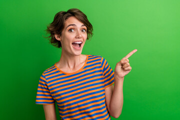 Photo portrait of pretty young girl finger point empty space excited dressed stylish striped outfit...