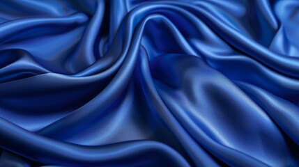 Obraz premium Silky satin fabric in a royal blue shade brings a smooth and luxurious texture to your background.
