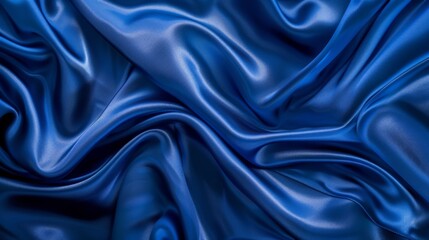 Obraz premium Silky satin fabric in a royal blue shade brings a smooth and luxurious texture to your background.