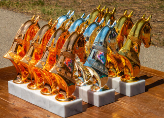 Prizes to the winners of the races in the form of statuettes of horses.