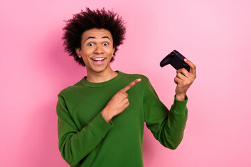 Photo of happy positive guy point video game console advertising isolated pastel color background