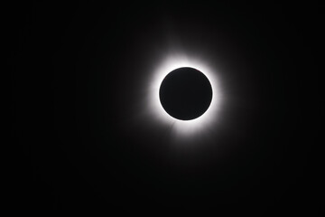 A black and white image of the total solar eclipse. Simple background image. Landscape