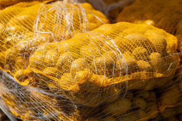 harvested potatoes for sale in a net
