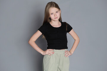 With hands on her hips, she portrays a stance of strength. Reflecting the boldness and...