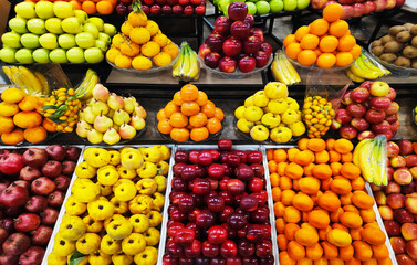 Apples, pears, pomegranates, bananas, oranges, grapes, kiwis, persimmons and other fruits on...