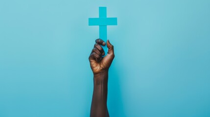 A Hand Holding a Cross