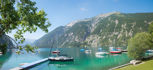 harbor with sailboats, view to Seebergspitze mountain, austria tyrol