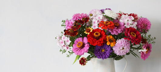 bouquet close-up. phlox, asters and zinnias, garden cultivated flowers. white background.