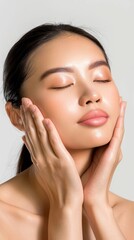 Serene Asian Woman Practicing Facial Massage Techniques for Skin Vitality and Radiance