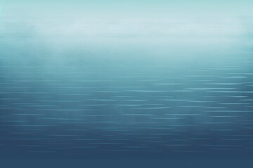 Obraz premium A blue ocean with ripples in the water