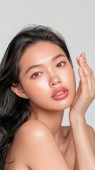 Fototapeta premium Youthful Asian Woman Showcasing Radiant Skin and Healthy Skincare Routine in Cinematic Style Portrait
