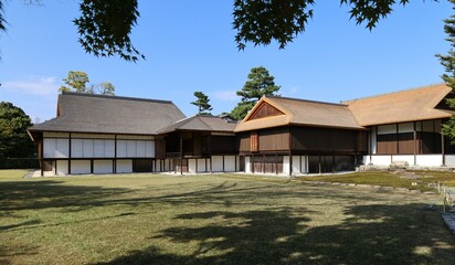 A Japanese traditional house with a thatched roof