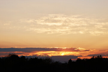 Evening sky with dramatic clouds at sunset. Stunning sunset.