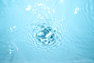 The surface of the water is clear, blue, soft and shiny.