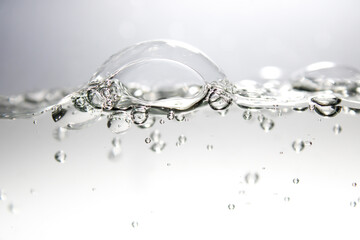 Air bubbles and clear water surface.