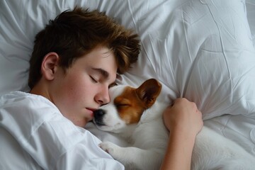 Young man sleeping with his dog