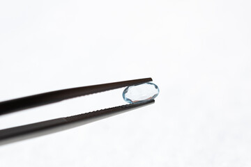 Blue aquamarine or topaz gemstone. Loose stone on white background