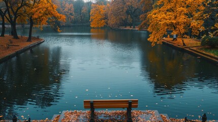 A bench is placed by a lake with a tree in the background