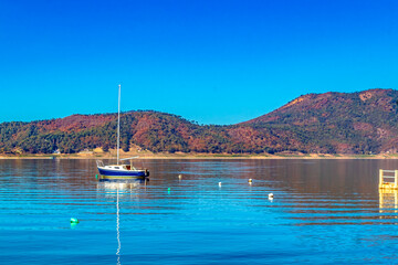 Boats and motorboats on sunny lake, in Valle de Bravo state of Mexico 