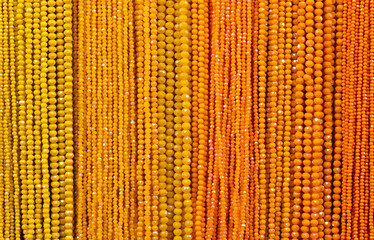 columns with yellow ocher orange beads various colored shades on sale in the fashion accessories...