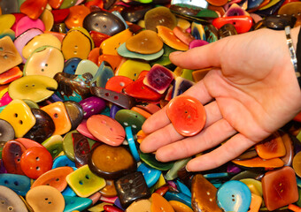 many colored buttons created from the seed of the Tagua plant also known as vegetable ivory and...