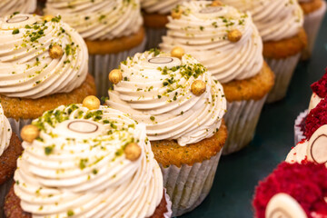 Sweet dessert fresh baked meringue cup cakes in bakery