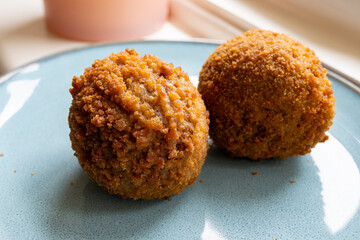 Traditional street food in UK, stuffed fried Scotch eggs with breadcrumbs close up