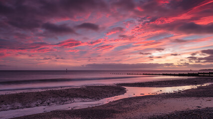 Blyth Beach, Northumberland, England, UK.  Sunrise sea view. Morning light over beach.