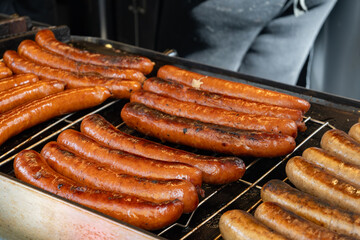 German street food on Portobello road Saturday food market, London, Uk, many BBQ grilled sausages ready to eat in outdoor café