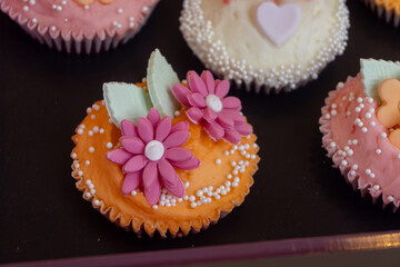 Colorful marzipan almongs cakes with decorative marzipan flowers