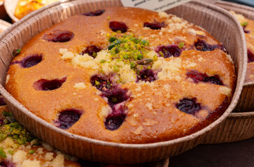 Sweet pastries, rustic apple cakes, cherry, almond cakes on food market in London, UK
