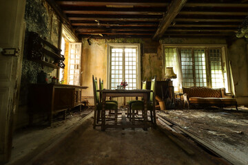 empty dining room in an abandoned lost place house