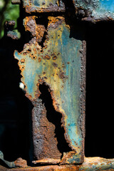 Rust on iron bar with blue and yellow color.Corrosive grunge rusted on old iron.Pattern grunged rust as illustration for presentation background.Rusty corrosion or oxidized texture.Close up.