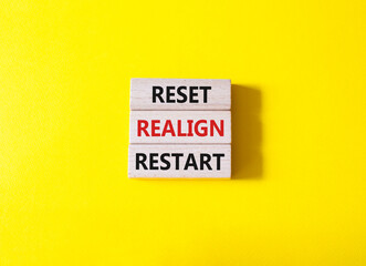 Reset Realign Restart symbol. Concept words Reset Realign Restart on wooden blocks. Beautiful...