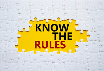 Know the rules symbol. Concept words Know the rules on white puzzle. Beautiful yellow background....