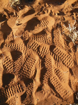 Shoe prints in sand, footprints, sand imprints, shoeprint in sand
