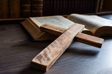 Large wooden cross on the Bible, Christian concept, religious symbol