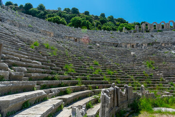 Picturesque ruins of an amphitheater in the ancient city of Perge, Turkey. Perge open-air museum.